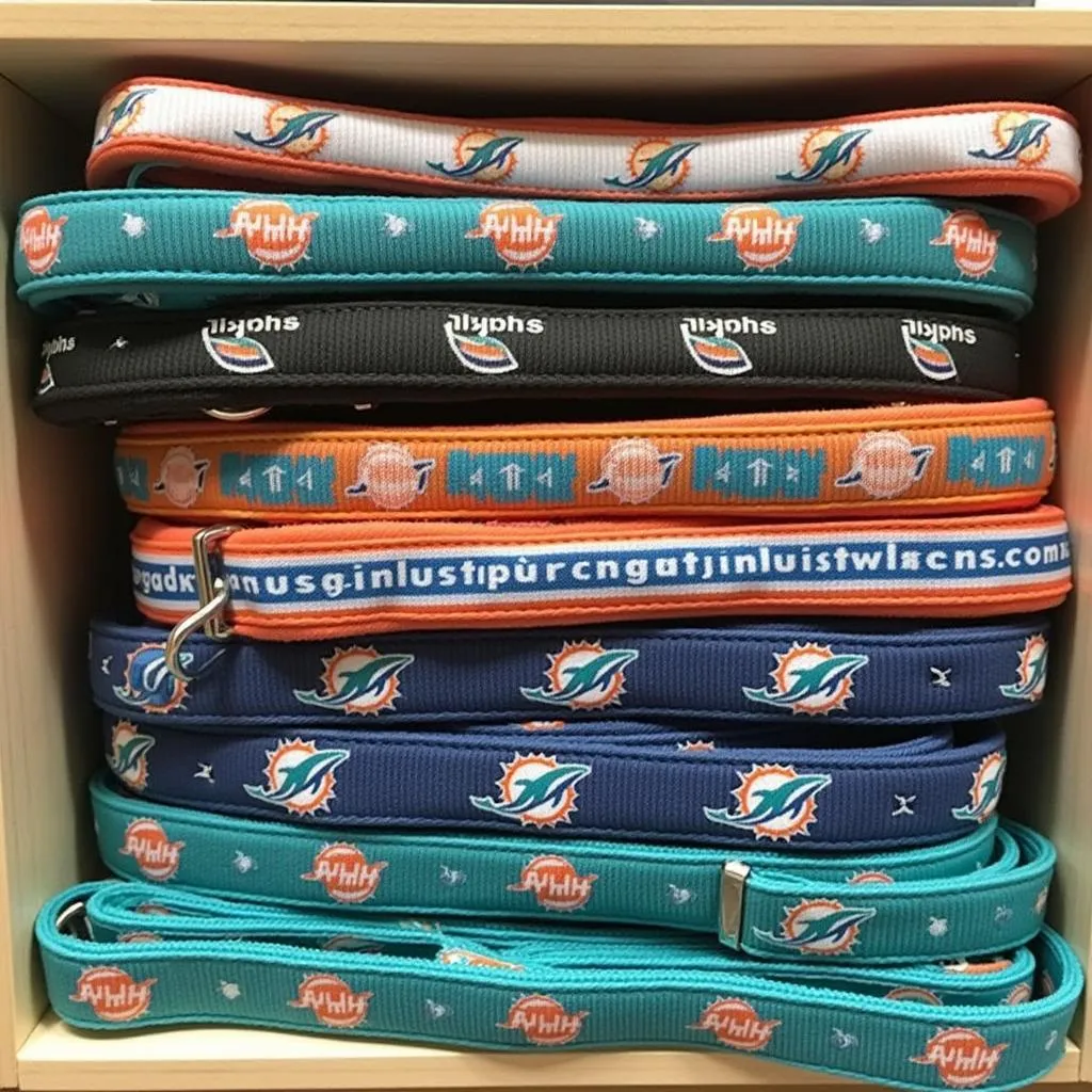 A collection of Miami Dolphins dog collars in different designs and sizes